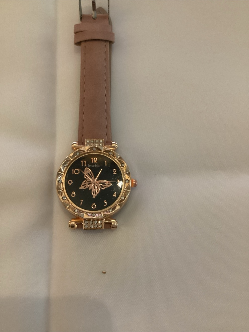 chic Gold-Tone Watch with Pink Strap and Black Dial
